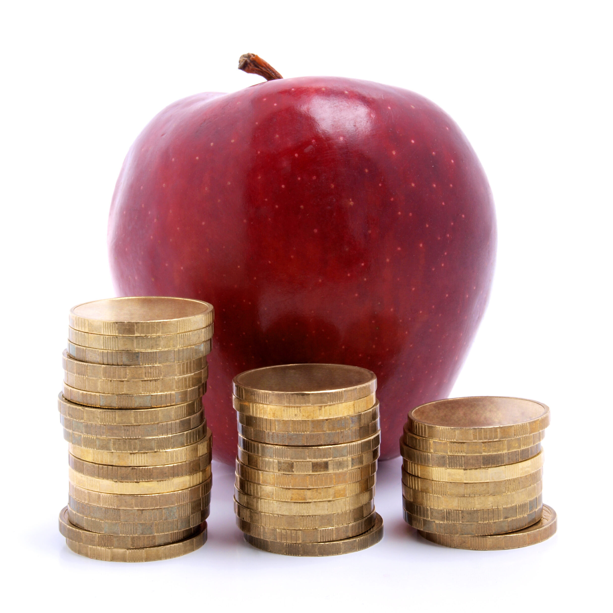 Color photo of an apple and a stack of coins